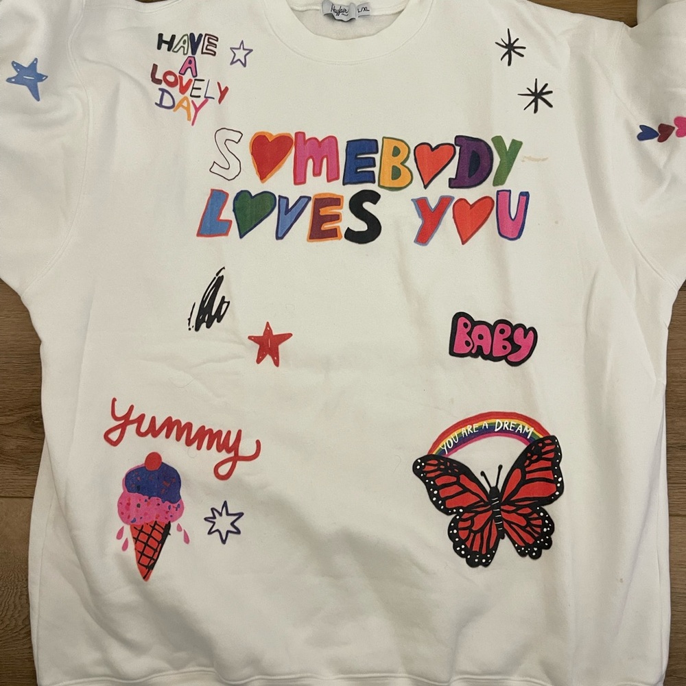 White and Red Graphic Sweatshirt with Playful Designs